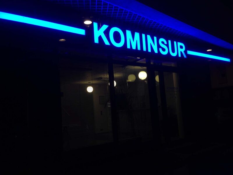 Kominsure blue line and logo